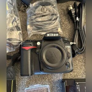 Pre owned DSLR Nikon D7000 body with bag and accessories.